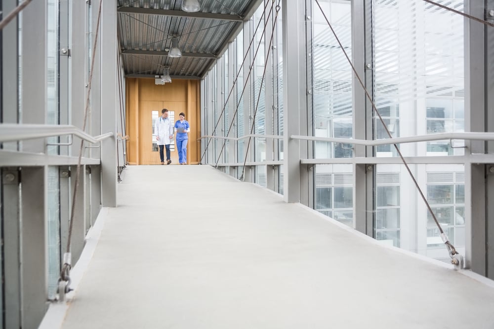 Medical team walking down hallway at the hospital